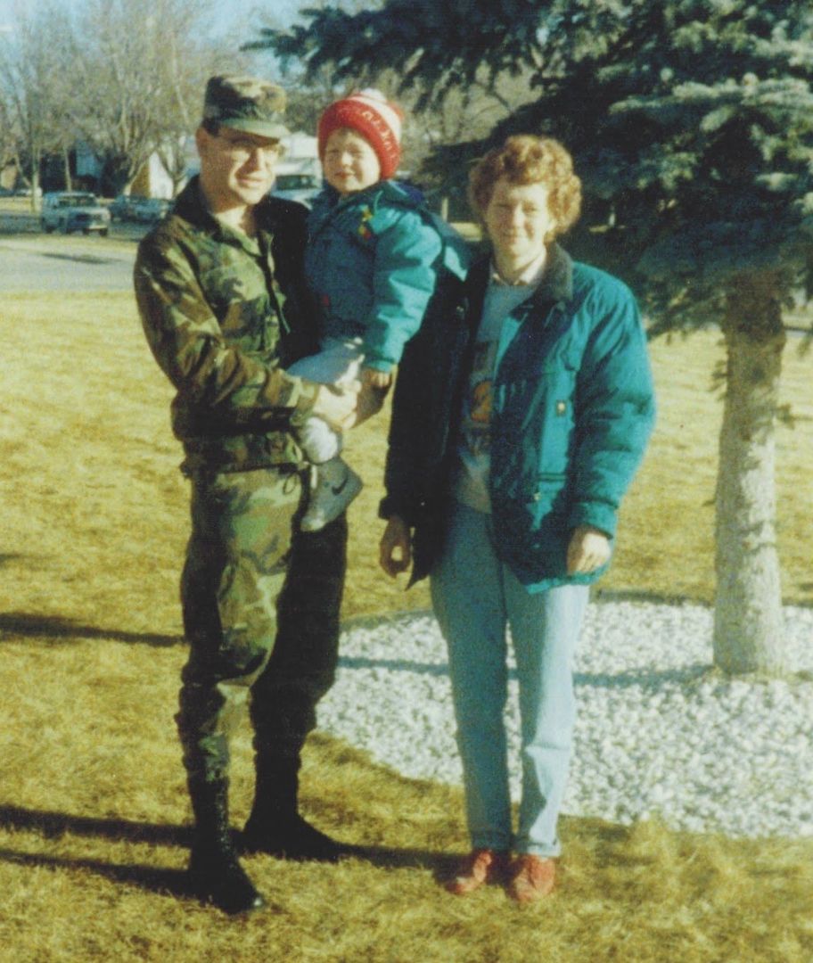 Old photo of a young Tim Walz with his parents.